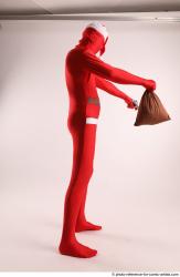 JOEL_ADAMSON CHRISTMAS VALLAIN WITH GUN AND BAG